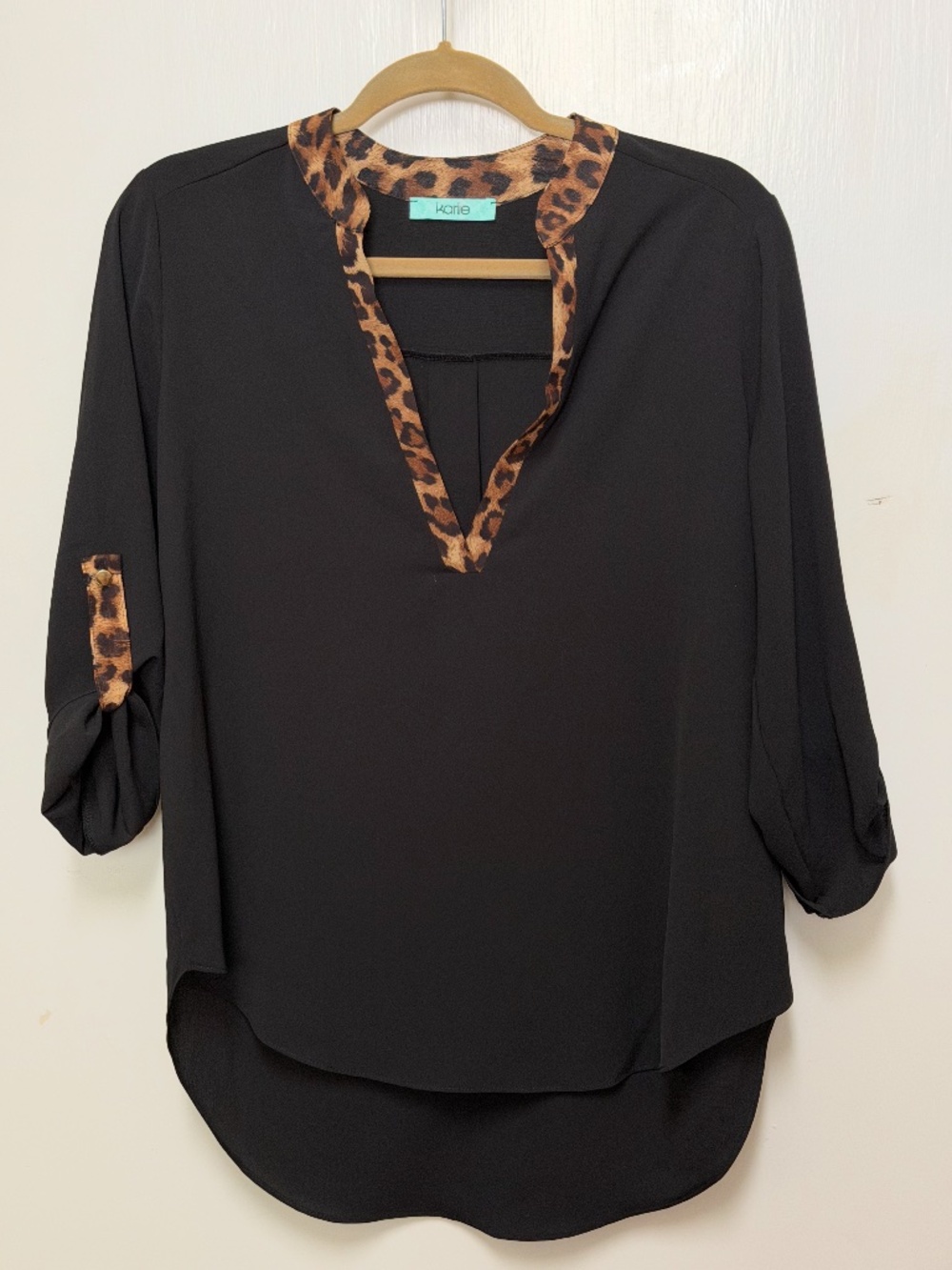 Karlie black long-sleeve blouse with a leopard print trim